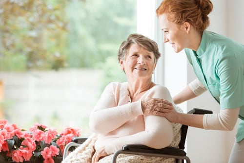 home aide with patient in wheelchair